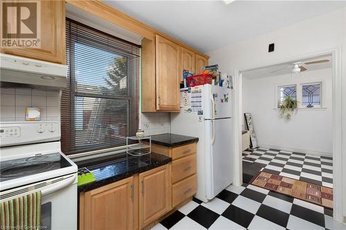 Kitchen featuring white appliances, ventilation hood, tasteful backsplash, and ceiling fan - 349 Kipling Avenue, Etobicoke, ON - Indoor Photo Showing Kitchen