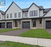 View of front facade with a front yard and a garage - 3C Balsam Street, Innerkip, ON  - Outdoor With Facade 