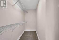 Spacious closet featuring carpet flooring - 