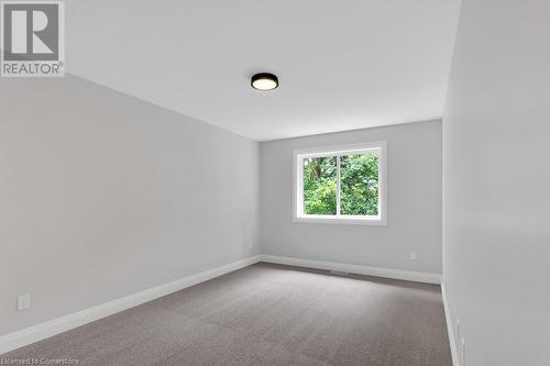 Unfurnished room featuring carpet floors - 3C Balsam Street, Innerkip, ON - Indoor Photo Showing Other Room