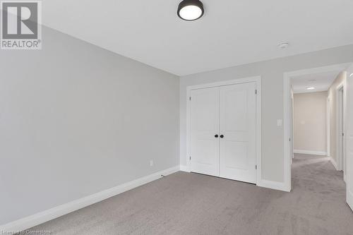 Unfurnished bedroom featuring light colored carpet and a closet - 3C Balsam Street, Innerkip, ON - Indoor Photo Showing Other Room