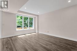 Spare room featuring hardwood / wood-style floors - 