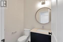 Bathroom with vanity and toilet - 