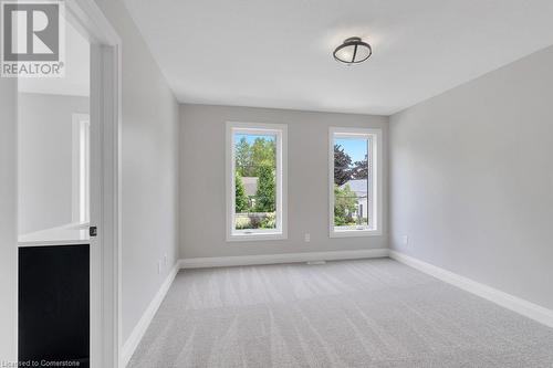 Unfurnished room featuring light carpet - 3C Balsam Street, Innerkip, ON - Indoor Photo Showing Other Room