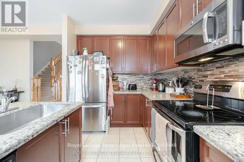 2 - 2220 Queensway Drive, Burlington, ON - Indoor Photo Showing Kitchen With Upgraded Kitchen