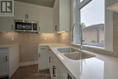 15 John Street S, Bluewater (Zurich), ON - Indoor Photo Showing Kitchen With Double Sink