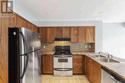 19 - 2342 Bois Vert Place, Ottawa, ON - Indoor Photo Showing Kitchen With Stainless Steel Kitchen With Double Sink