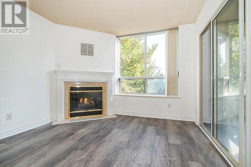 414 - 1 Ripley Avenue, Toronto, ON - Indoor Photo Showing Living Room With Fireplace