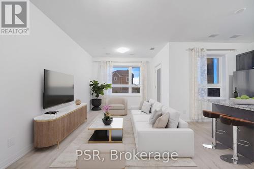 202 - 3285 Carding Mill Trail, Oakville, ON - Indoor Photo Showing Living Room