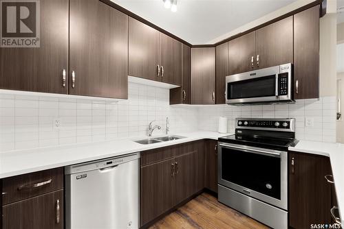 3347 Green Turtle Road, Regina, SK - Indoor Photo Showing Kitchen With Double Sink