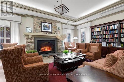 2510 - 100 Burloak Drive, Burlington (Appleby), ON - Indoor Photo Showing Living Room With Fireplace