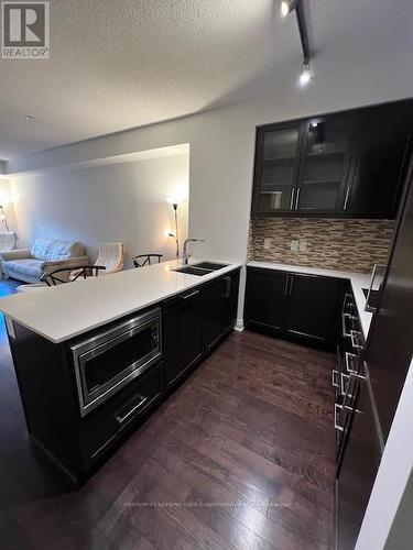 214 - 21 Clairtrell Road, Toronto, ON - Indoor Photo Showing Kitchen With Double Sink