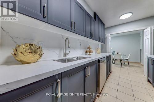 709 - 25 Silver Springs Boulevard, Toronto, ON - Indoor Photo Showing Kitchen With Double Sink