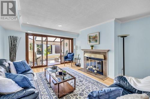 87D - 263 Botanica Pvt, Ottawa, ON - Indoor Photo Showing Living Room With Fireplace