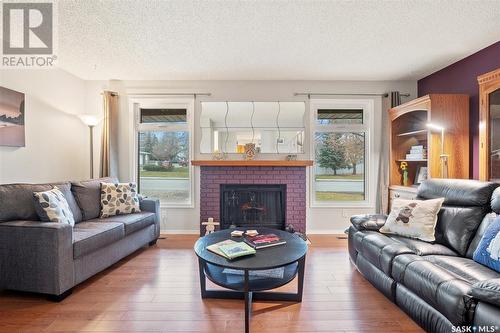 215 La Ronge Road, Saskatoon, SK - Indoor Photo Showing Living Room With Fireplace