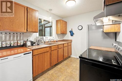 215 La Ronge Road, Saskatoon, SK - Indoor Photo Showing Kitchen With Double Sink