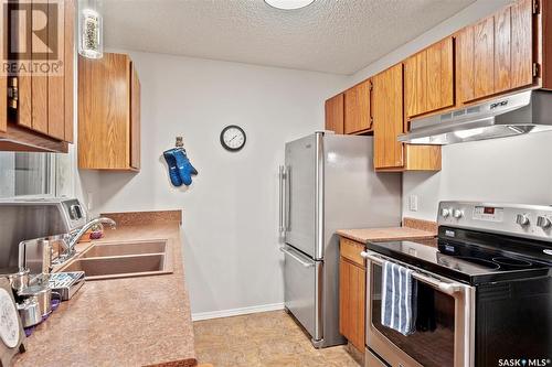 215 La Ronge Road, Saskatoon, SK - Indoor Photo Showing Kitchen With Double Sink