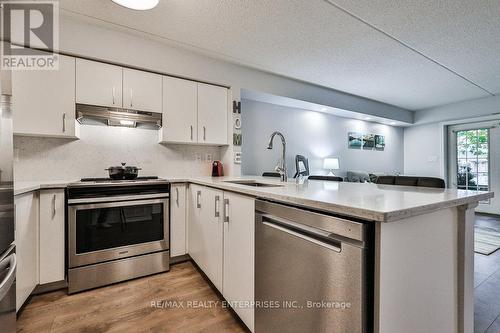 103 - 1460 Bishops Gate, Oakville, ON - Indoor Photo Showing Kitchen With Stainless Steel Kitchen With Upgraded Kitchen