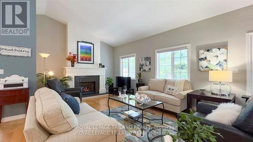 8846 Timberwood Trail, Lambton Shores (Grand Bend), ON - Indoor Photo Showing Living Room With Fireplace