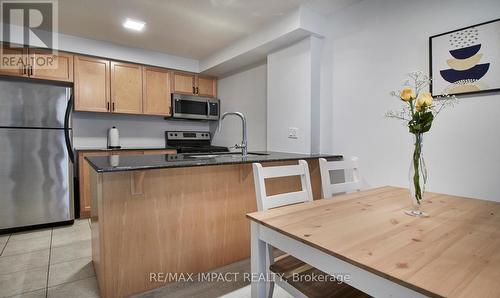 105 - 61 Clarington Boulevard N, Clarington (Bowmanville), ON - Indoor Photo Showing Kitchen With Double Sink