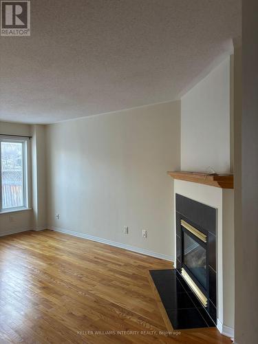 150 Blackdome Crescent, Ottawa, ON - Indoor Photo Showing Living Room With Fireplace