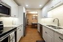 412-1450 Bertram Street, Kelowna, BC  - Indoor Photo Showing Kitchen With Double Sink With Upgraded Kitchen 