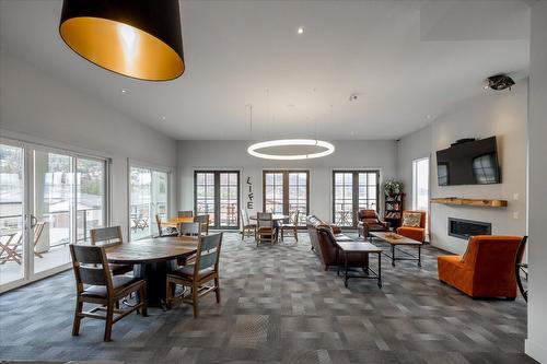 1681 Harbour View Crescent, Westbank, BC - Indoor Photo Showing Dining Room With Fireplace