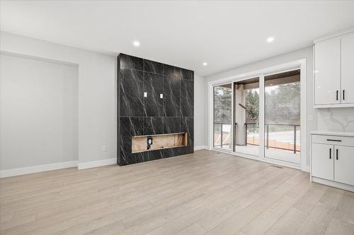 1681 Harbour View Crescent, Westbank, BC - Indoor Photo Showing Living Room With Fireplace