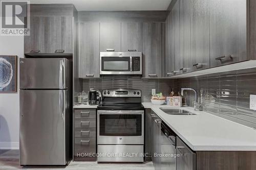 707 - 150 Main Street W, Hamilton, ON - Indoor Photo Showing Kitchen With Double Sink With Upgraded Kitchen