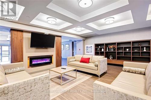 707 - 150 Main Street W, Hamilton, ON - Indoor Photo Showing Living Room With Fireplace