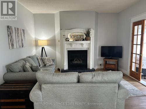 434 Alder Street E, Haldimand, ON - Indoor Photo Showing Living Room With Fireplace