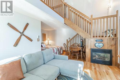 3978 South Portage Road, Huntsville, ON - Indoor Photo Showing Living Room With Fireplace