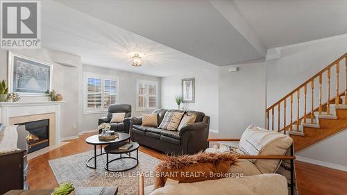 5 - 7 Southside Place, Hamilton, ON - Indoor Photo Showing Living Room With Fireplace