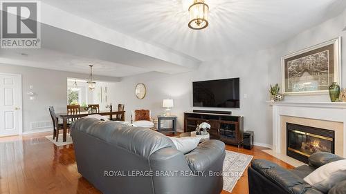 5 - 7 Southside Place, Hamilton, ON - Indoor Photo Showing Living Room With Fireplace