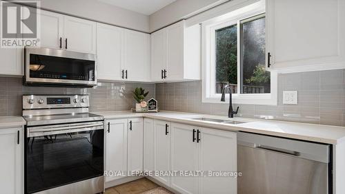 5 - 7 Southside Place, Hamilton, ON - Indoor Photo Showing Kitchen With Double Sink