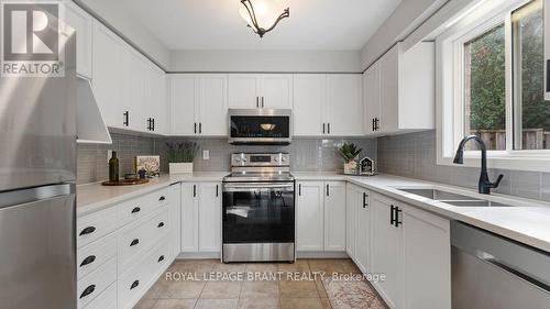 5 - 7 Southside Place, Hamilton, ON - Indoor Photo Showing Kitchen With Double Sink