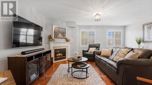 5 - 7 Southside Place, Hamilton, ON - Indoor Photo Showing Living Room With Fireplace