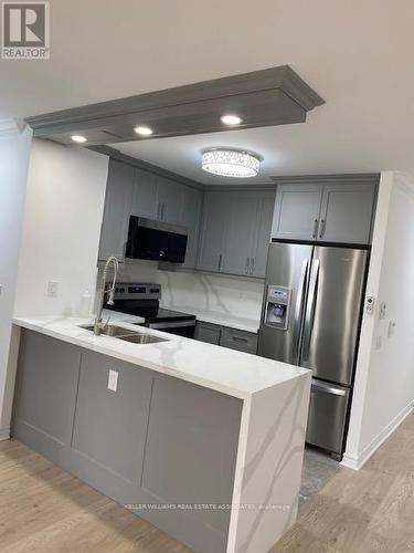 1008 - 35 Kingsbridge Garden Circle, Mississauga, ON - Indoor Photo Showing Kitchen With Double Sink