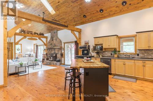 3404 Base Line, Otonabee-South Monaghan, ON - Indoor Photo Showing Kitchen With Fireplace