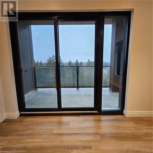 Doorway to outside with light hardwood / wood-style flooring - 525 New Dundee Road Unit# 602, Kitchener, ON - Indoor Photo Showing Other Room