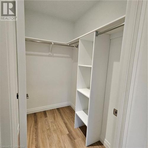 Spacious closet with light hardwood / wood-style floors - 525 New Dundee Road Unit# 602, Kitchener, ON - Indoor With Storage