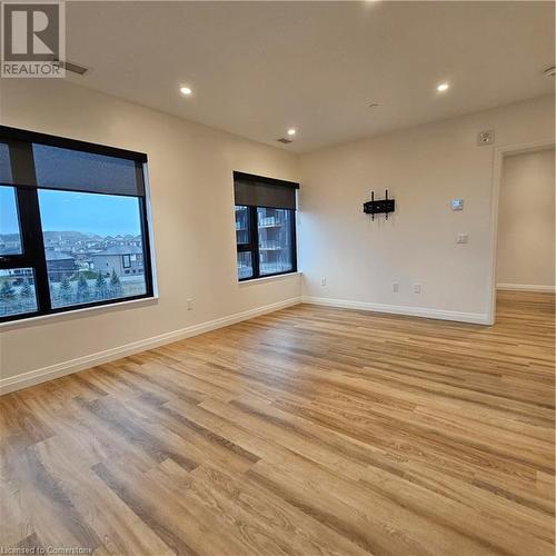 Unfurnished room featuring light hardwood / wood-style flooring - 525 New Dundee Road Unit# 602, Kitchener, ON - Indoor Photo Showing Other Room