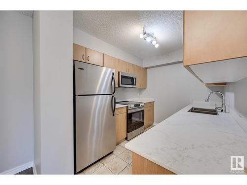 10180 104 St Nw, Edmonton, AB - Indoor Photo Showing Kitchen With Stainless Steel Kitchen With Double Sink