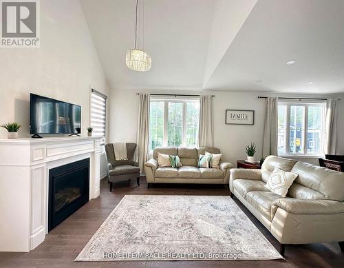 3205 Mosley Street, Wasaga Beach, ON - Indoor Photo Showing Living Room With Fireplace