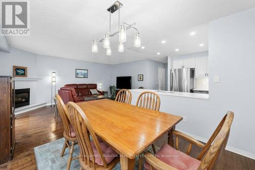 78 - 3333 New Street, Burlington, ON - Indoor Photo Showing Dining Room With Fireplace