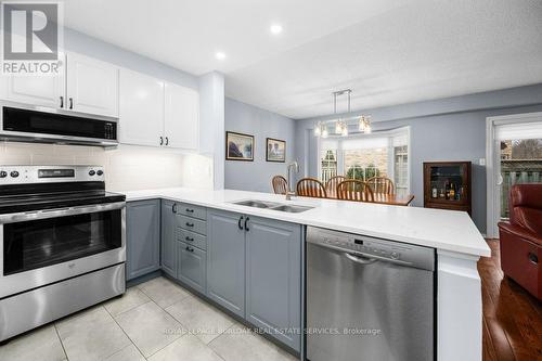 78 - 3333 New Street, Burlington, ON - Indoor Photo Showing Kitchen With Double Sink