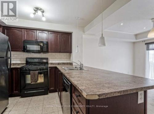 65 - 3250 Bentley Drive, Mississauga, ON - Indoor Photo Showing Kitchen With Double Sink