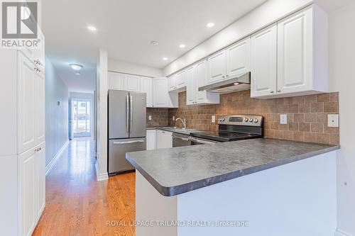 Eat-in kitchen w/ updated cabinets & appliances - 4 - 5 River Road, Lambton Shores (Grand Bend), ON - Indoor Photo Showing Kitchen