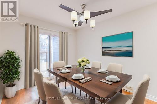 Dining area to riverfront deck (virtually staged) - 4 - 5 River Road, Lambton Shores (Grand Bend), ON - Indoor Photo Showing Dining Room