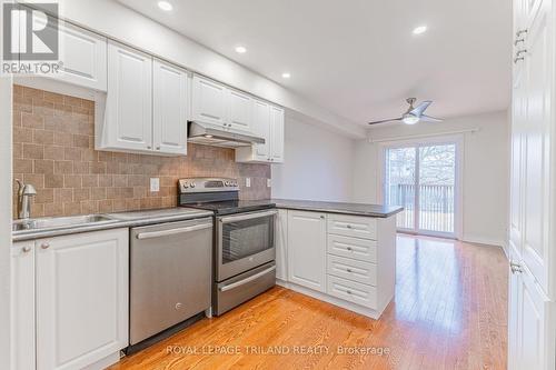 Dining area to riverfront deck (virtually staged) - 4 - 5 River Road, Lambton Shores (Grand Bend), ON - Indoor Photo Showing Kitchen